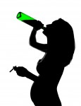 Silhouette of careless pregnant woman with alcohol and cigarette Silhouette of careless pregnant woman with alcohol and cigarette